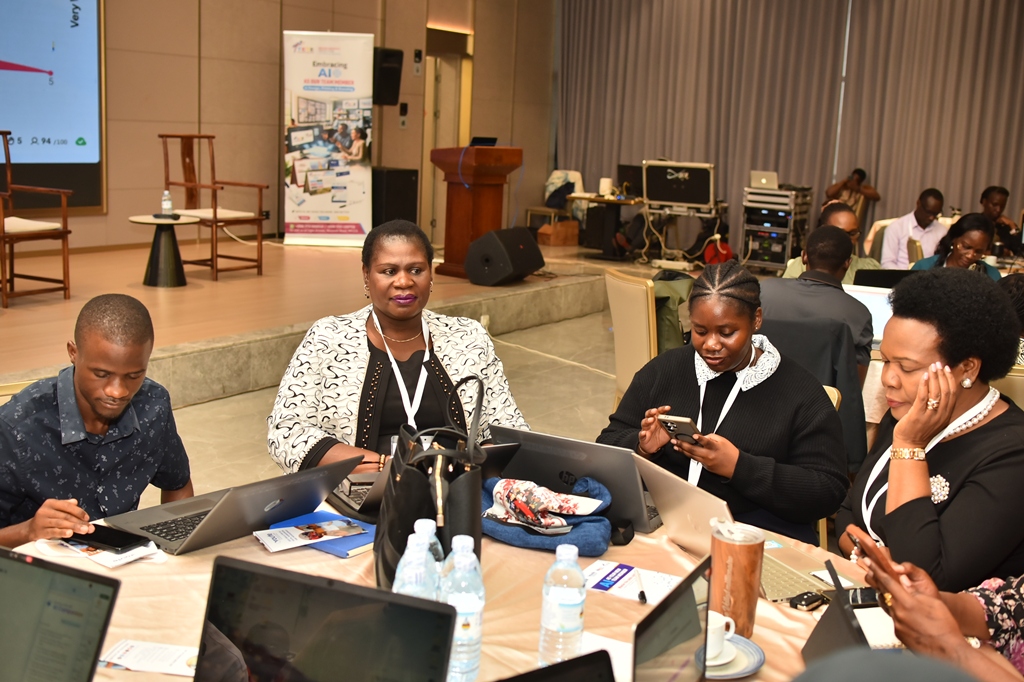 Business leaders working together during the Uganda AI Masterclass